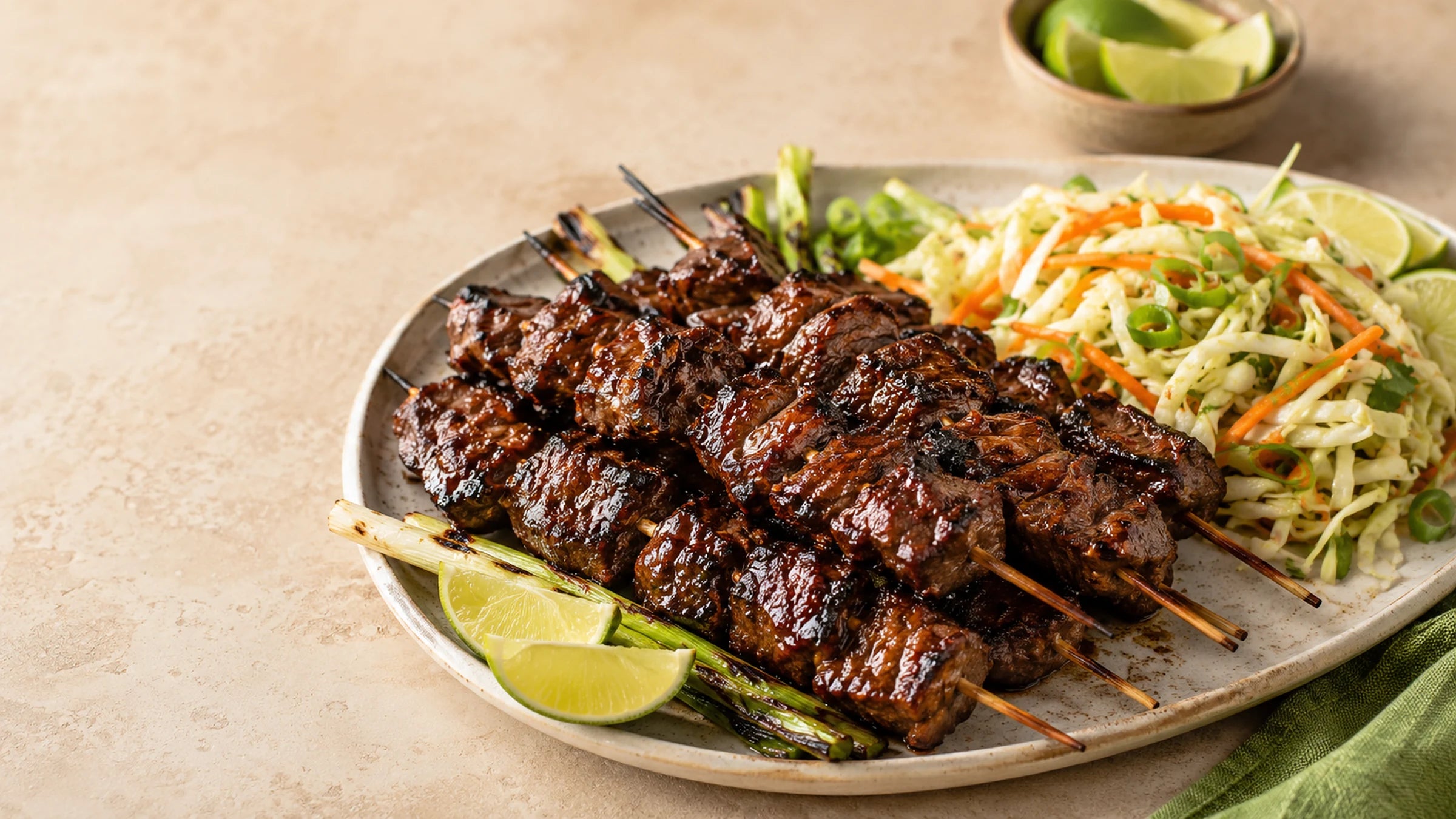 Caribbean BBQ beef skewers with scallion lime slaw