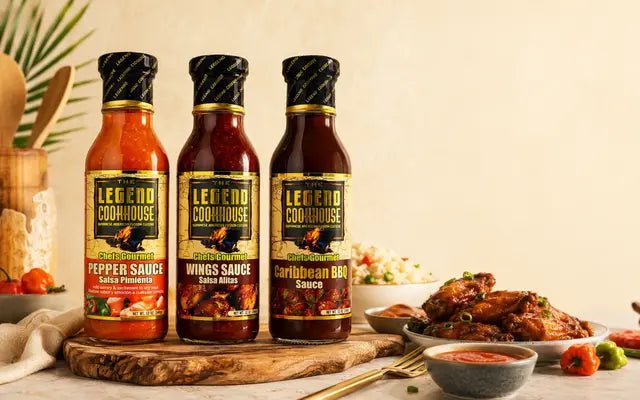 Legend Chefs Gourmet 3 Bottle Bundle sauces with wings, rice, and dipping sauce in a warm kitchen setting